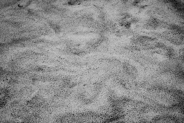 "Sand Swirl" by photographer Aranka Israni captures swirling patterns in the sand, black and white detail. Alys Beach, Florida. Black and white, limited edition print.