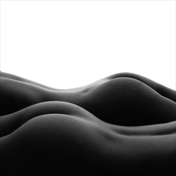 Two nude figures form an abstract landscape, represented here in exquisite form rendered in "Bodyscape Dunes" limited edition, black and white print by photographer Aranka Israni